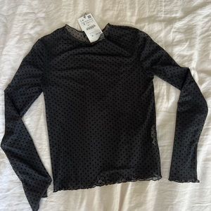 Mesh long sleeve polka dot shirt.